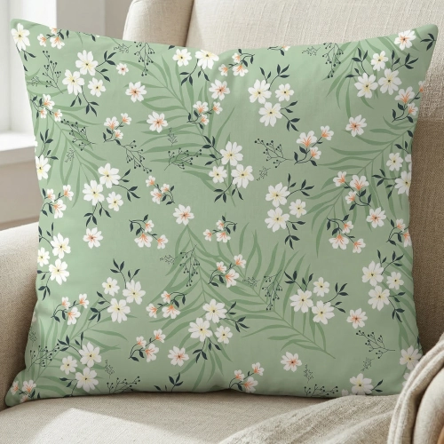 Bawełniana poszewka sypialniana we wzór w kwiaty i paprocie na łóżku