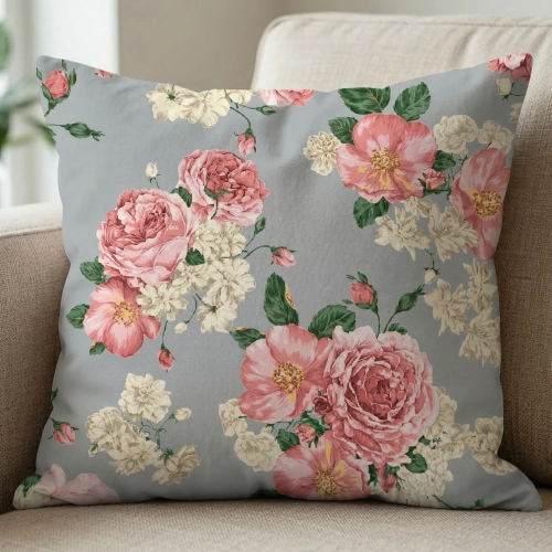 Ozdobna poszewka na jasiek we wzór Szare Róże na fotelu