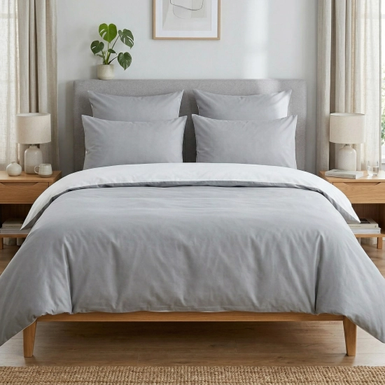 Dwustronny komplet pościeli bawełnianej premium J&W Zimowy Poranek w nowoczesnej sypialni.