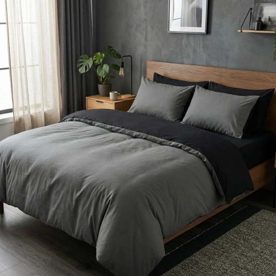 Dwustronny komplet pościeli bawełnianej premium J&W Onyksowa Noc w eleganckiej, nowoczesnej sypialni.