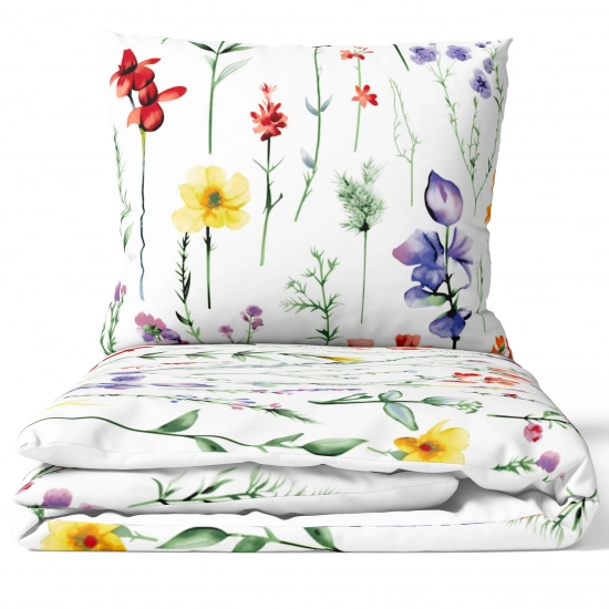 Złożony komplet pościeli bawełnianej J&W Akwarelowa Łąka na białym tle, widoczny radosny, botaniczny wzór.
