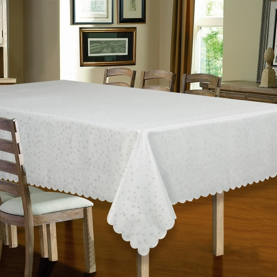 Biały obrus świąteczny w srebrne gwiazdki 160x300 cm na dużym stole
